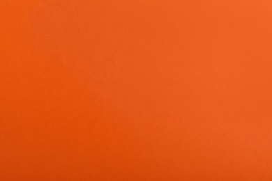 Photo of Abstract orange background, top view. Colorful paper