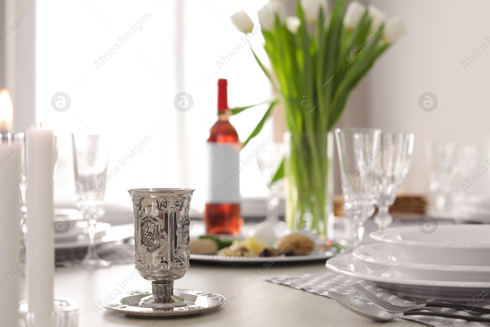 Photo of Table served for Passover (Pesach) Seder indoors, space for text