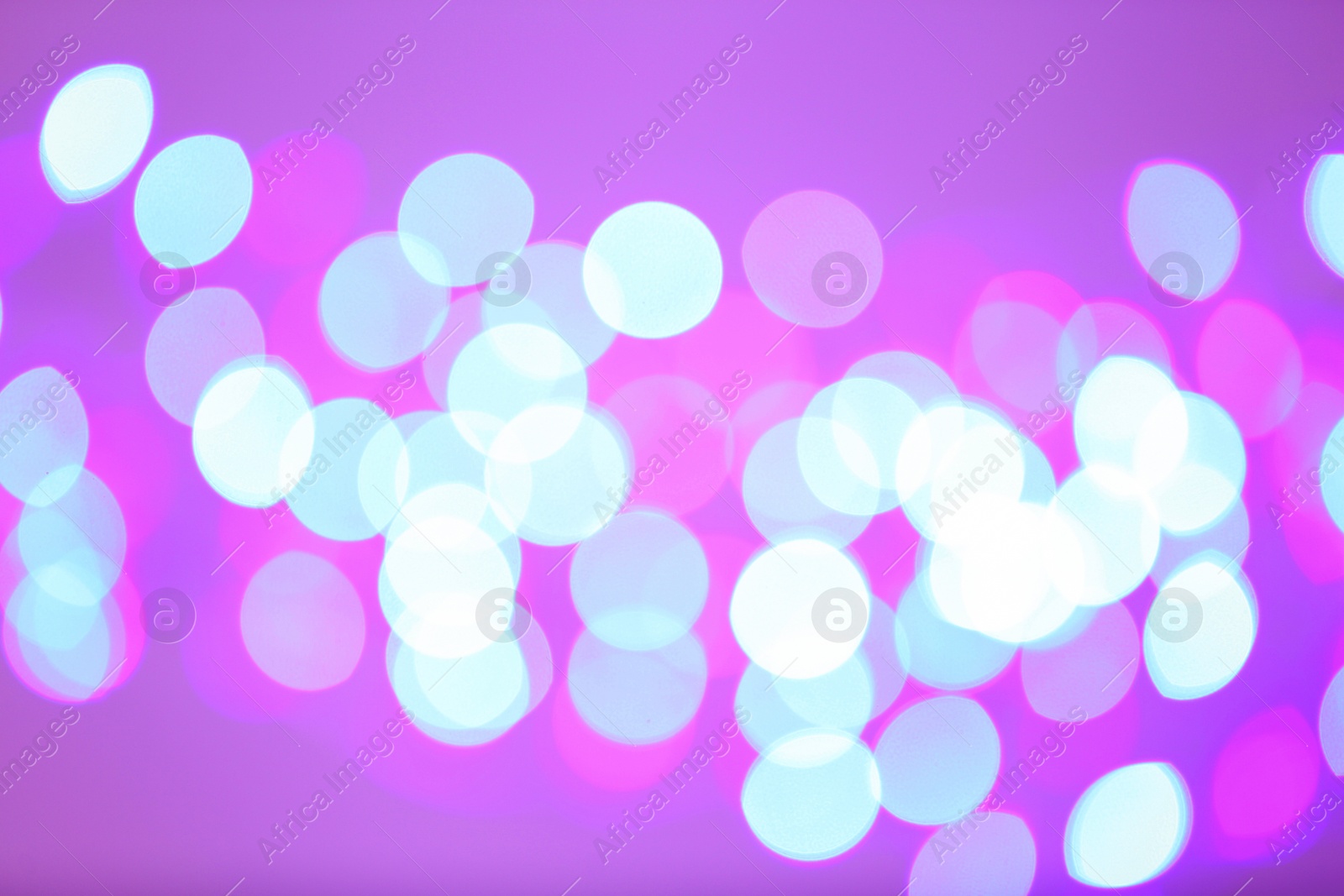 Photo of Beautiful glowing lights as background. Bokeh effect