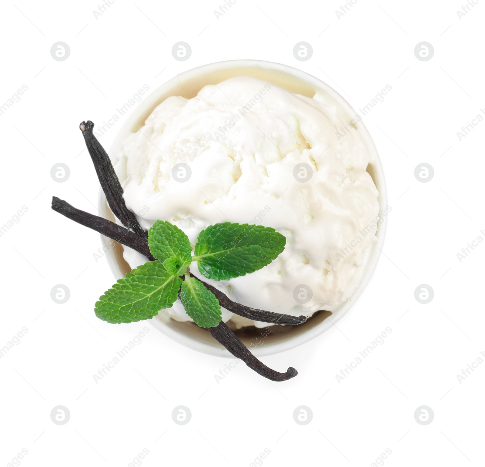 Photo of Delicious ice cream with mint and vanilla in paper cup isolated on white, top view