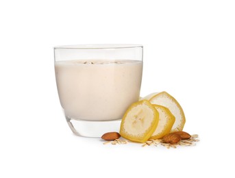 Photo of Glass of tasty banana smoothie with almonds and oatmeal on white background