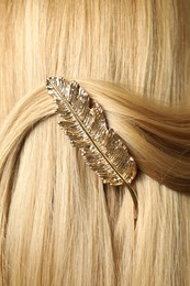 Woman with beautiful gold hair clip, closeup