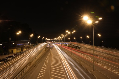 Photo of Night road with illumination in modern city