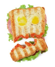 Cute monster sandwich with fried eggs isolated on white, top view. Halloween snack