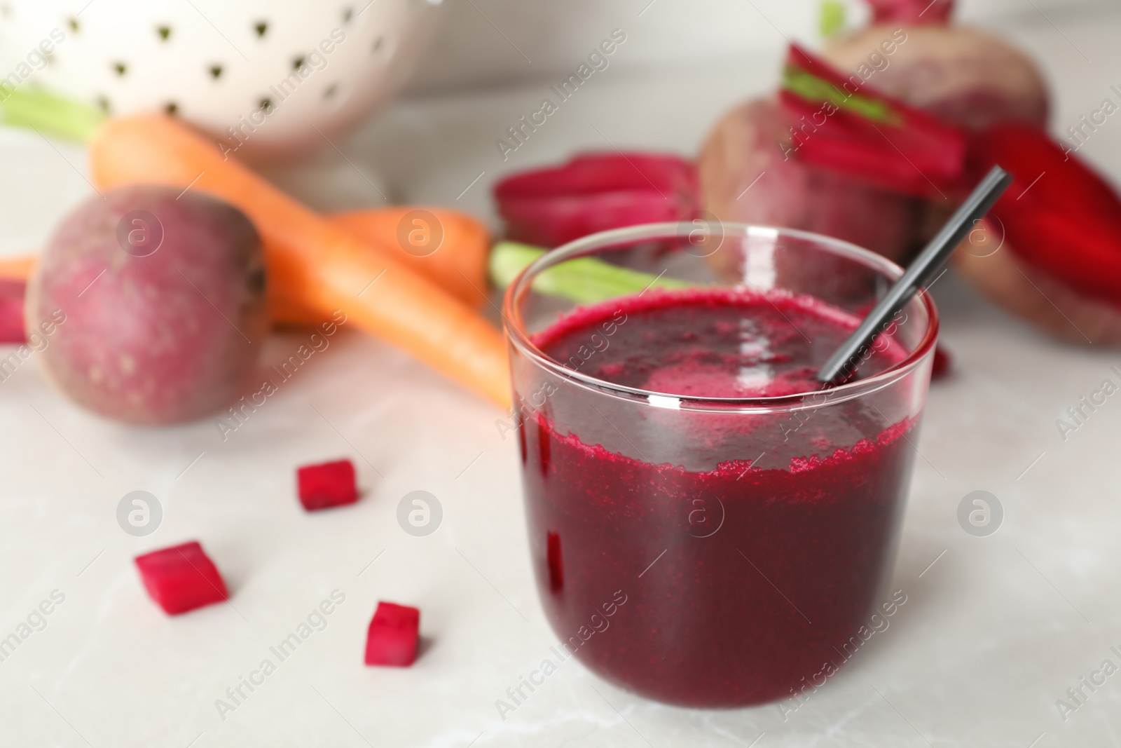 Photo of Glass of fresh beet juice on table