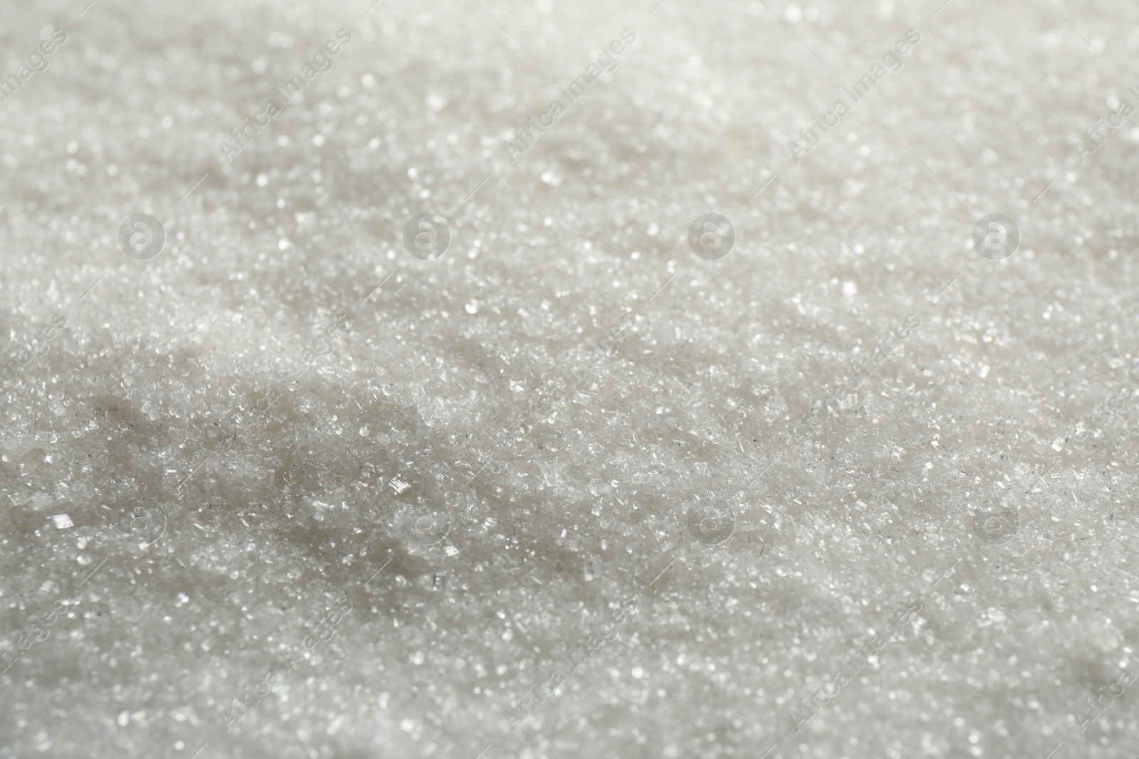 Photo of Pile of granulated sugar as background, closeup