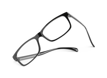 Photo of Stylish glasses with black frame isolated on white