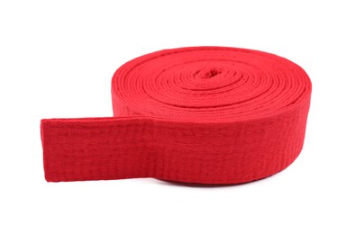 Photo of Red karate belt isolated on white. Martial arts uniform
