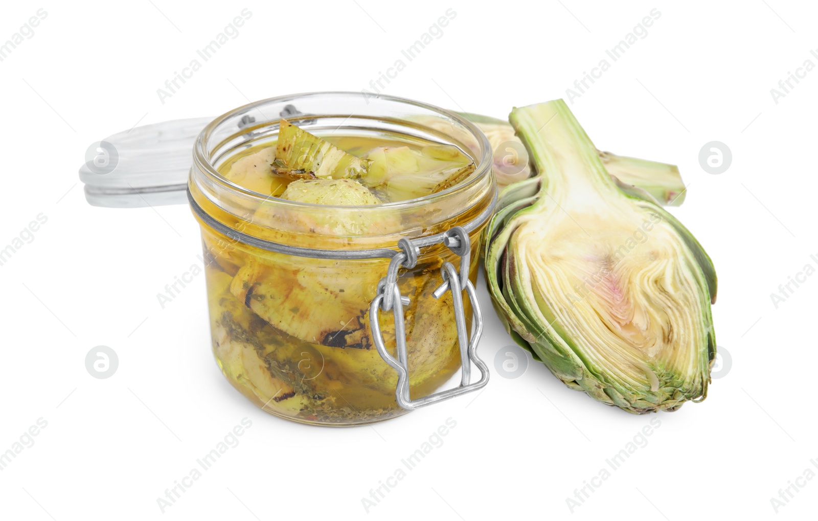 Photo of Open jar of delicious artichokes pickled in olive oil and fresh vegetables on white background