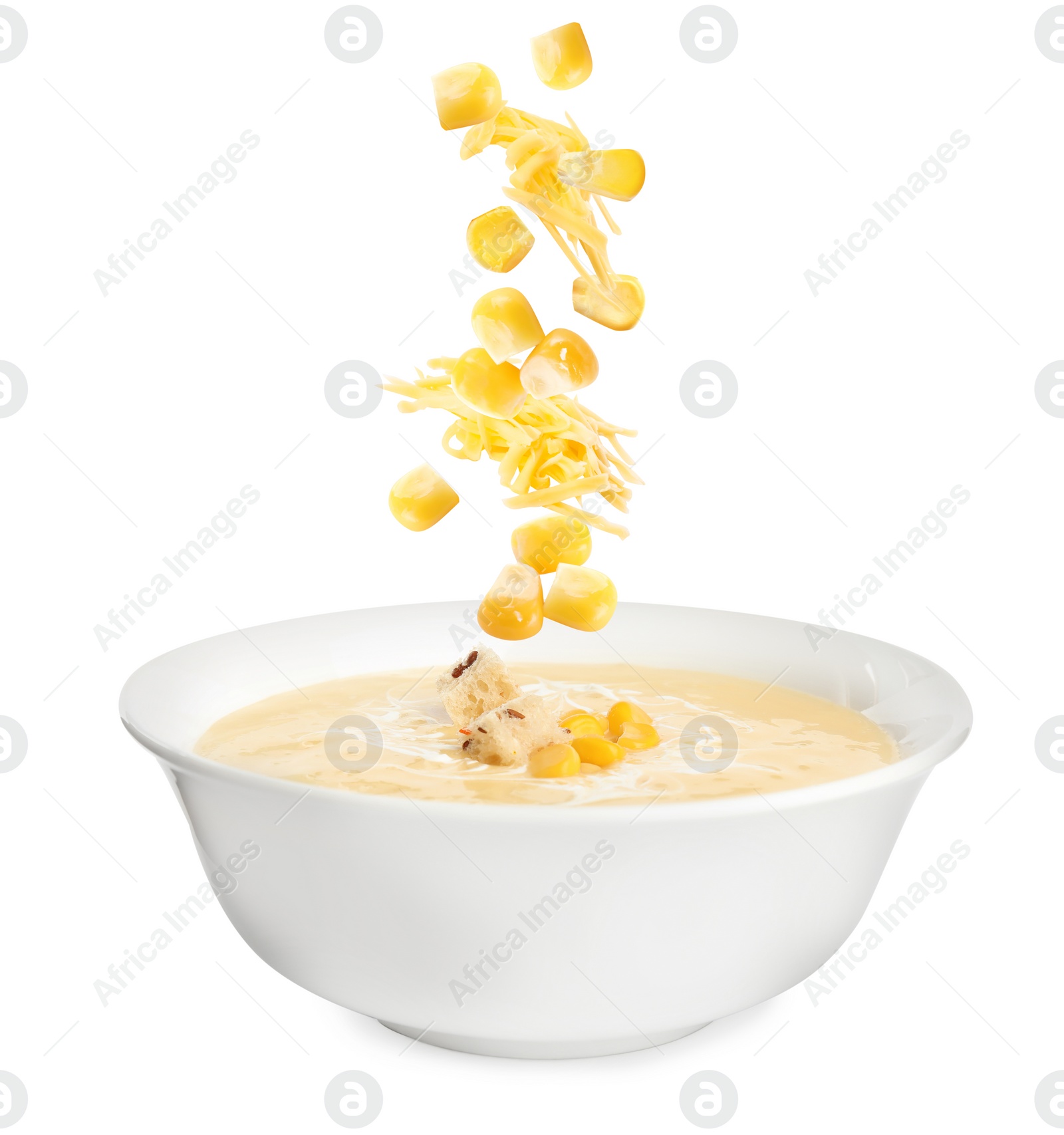 Image of Collage with ingredients falling into bowl of corn soup on white background 