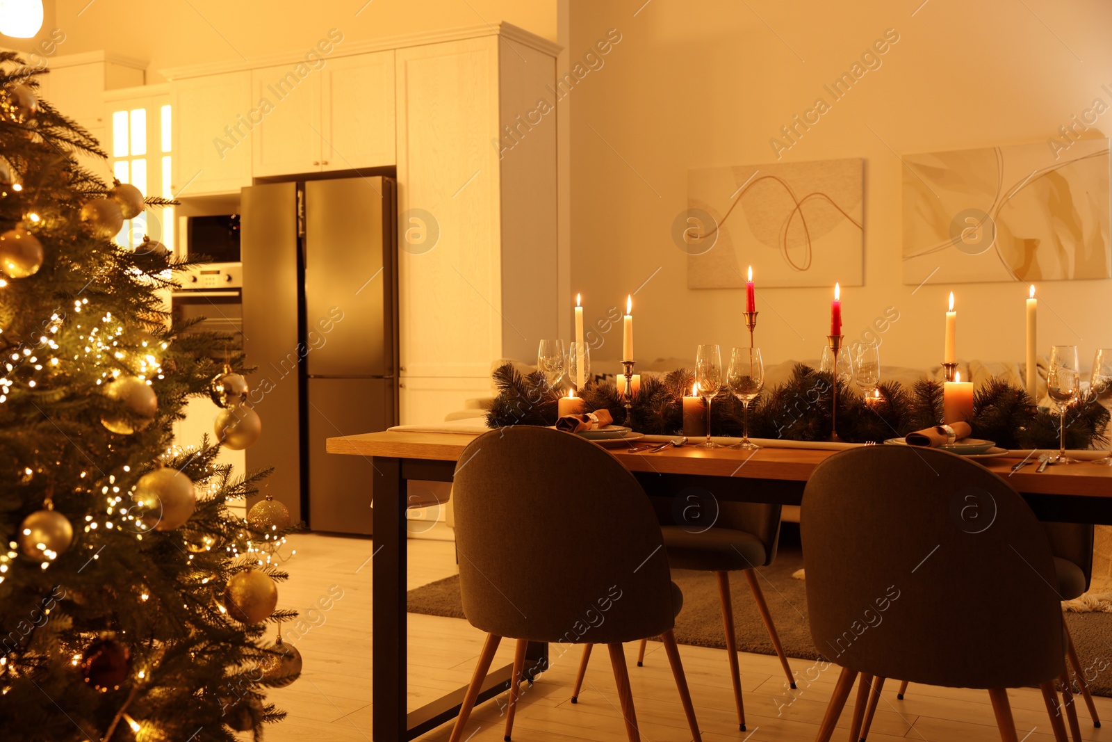 Photo of Cozy spacious kitchen decorated for Christmas. Interior design