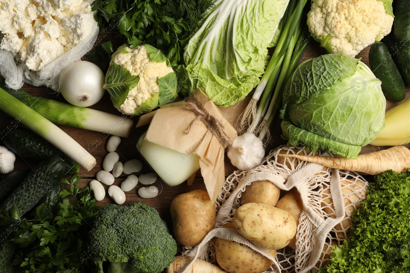 Photo of Different fresh farm products on wooden table, flat lay