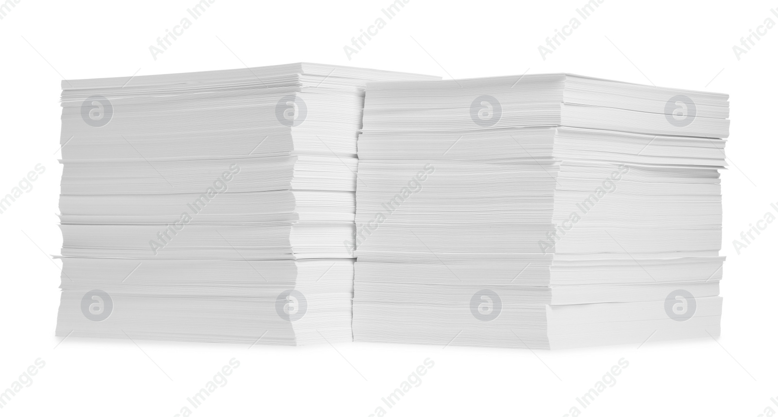 Photo of Stacks of paper sheets on white background