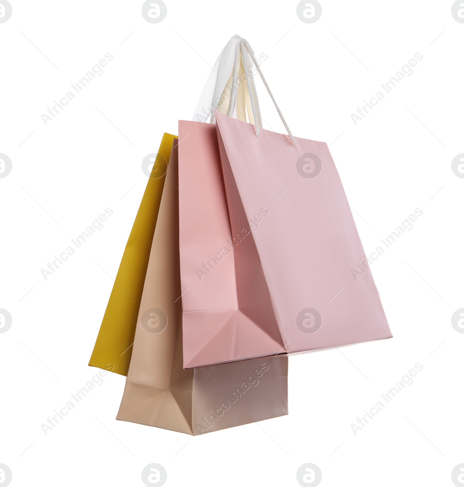 Photo of Colorful paper shopping bags isolated on white