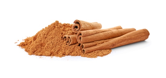 Photo of Aromatic cinnamon sticks and powder on white background