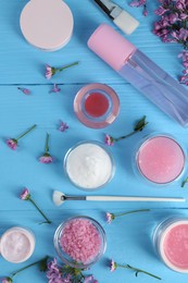 Photo of Flat lay composition with homemade cosmetic products and fresh ingredients on light blue wooden table