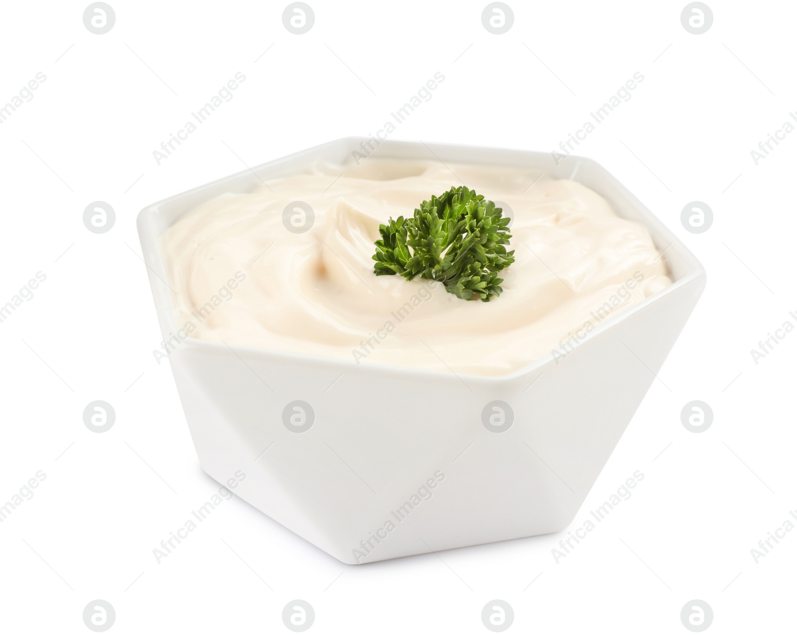 Photo of Bowl of tasty mayonnaise with parsley isolated on white