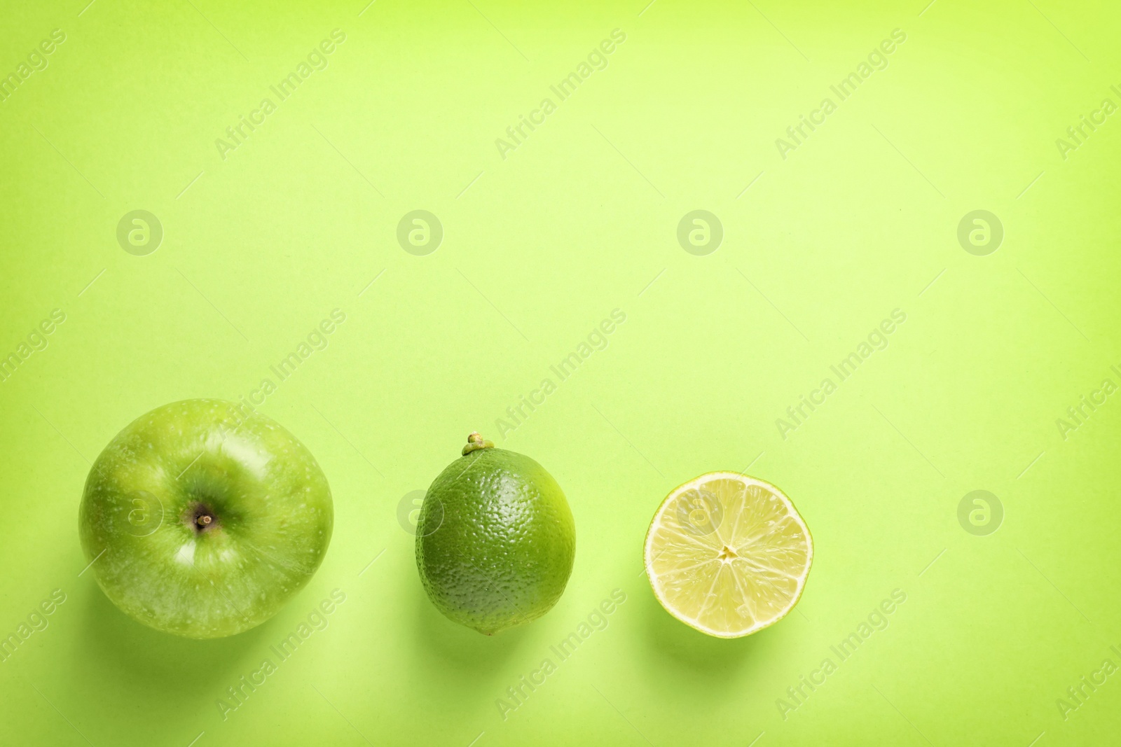 Photo of Flat lay composition with fresh fruits on color background