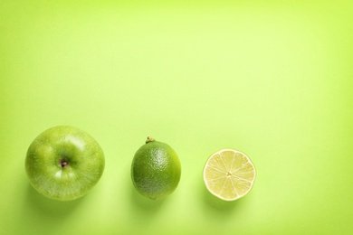 Photo of Flat lay composition with fresh fruits on color background