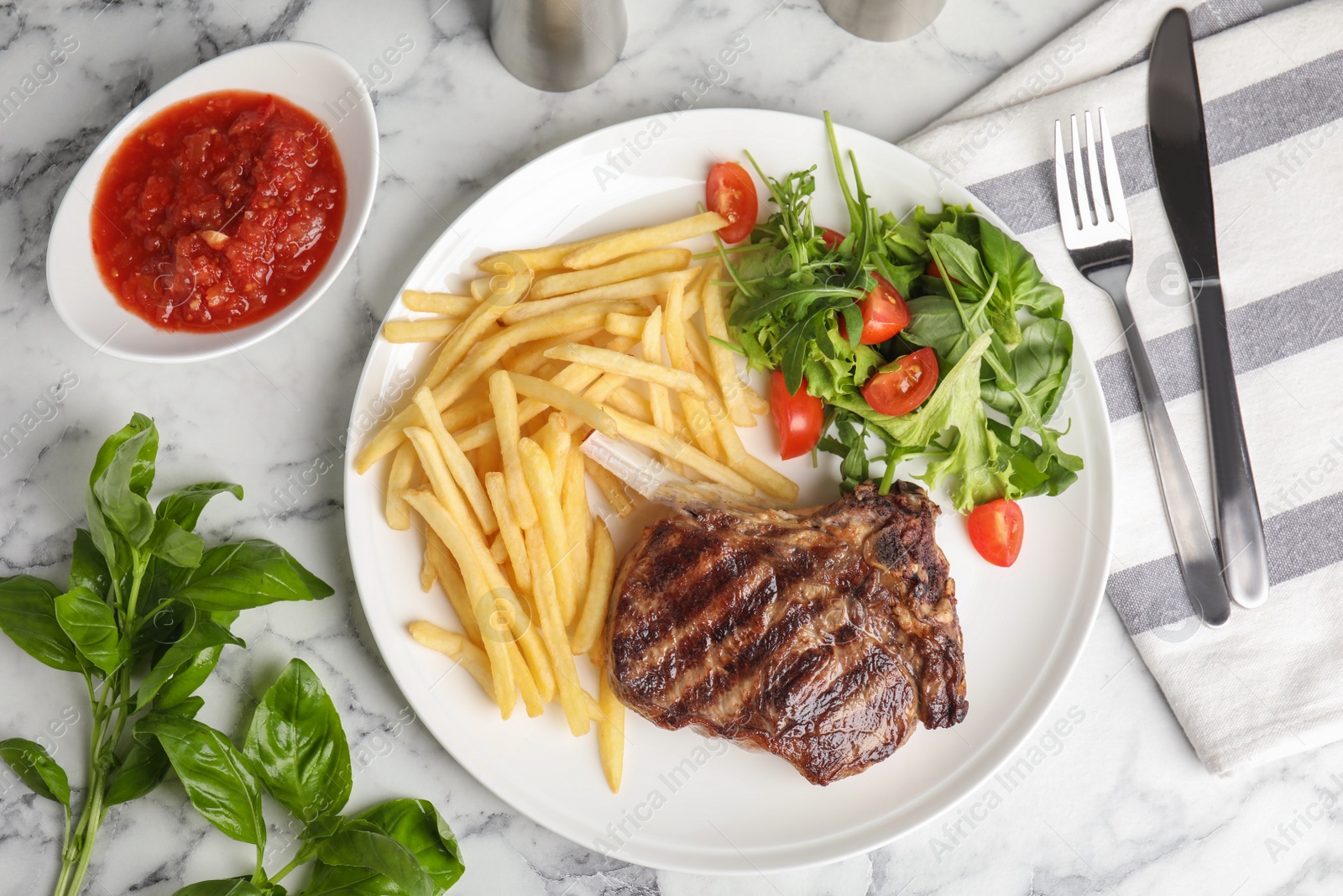 Photo of Flat lay composition with grilled beef steak on white marble table