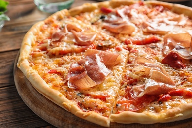 Delicious hot pizza with meat on table