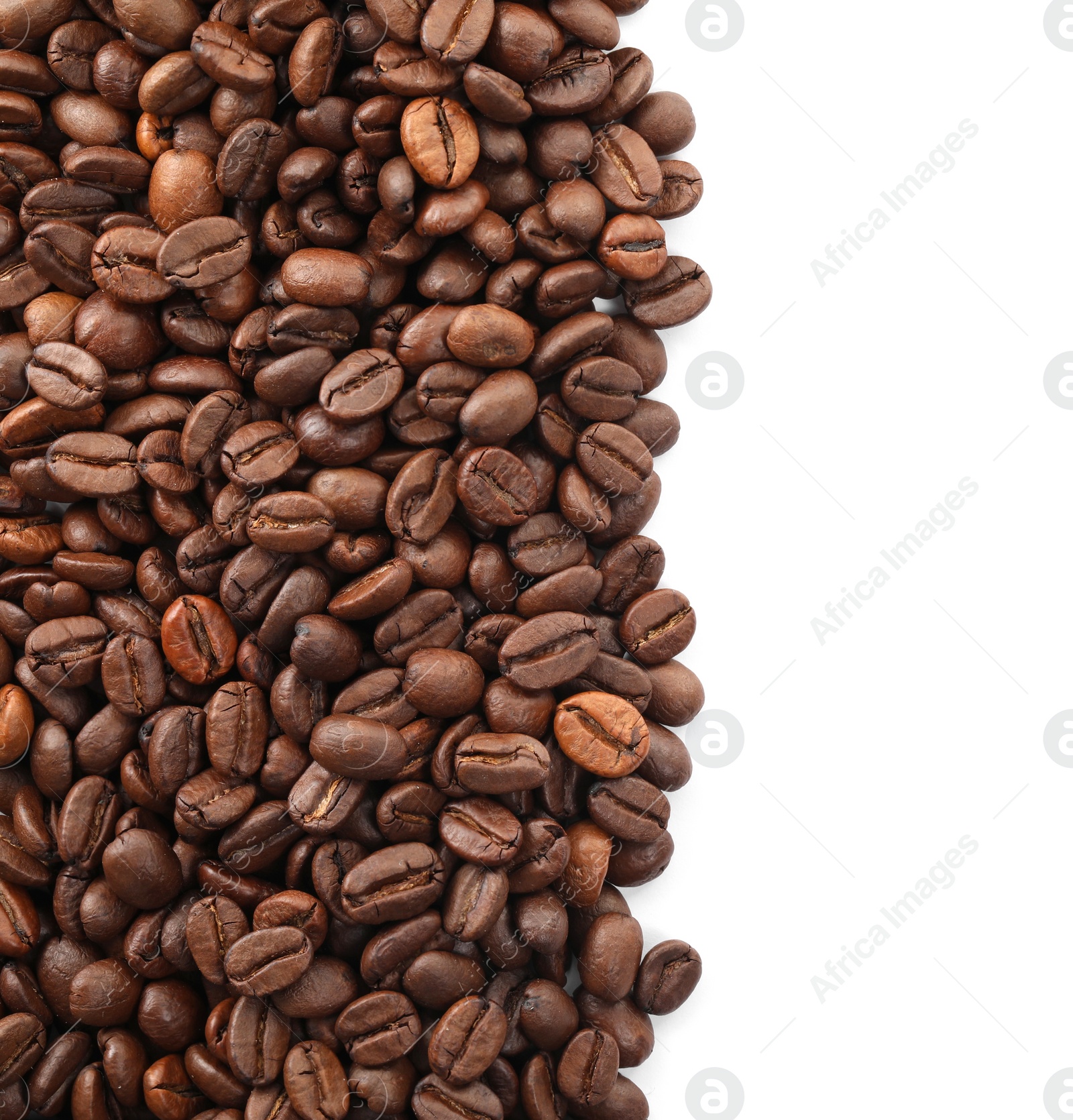 Photo of Many roasted coffee beans isolated on white , top view