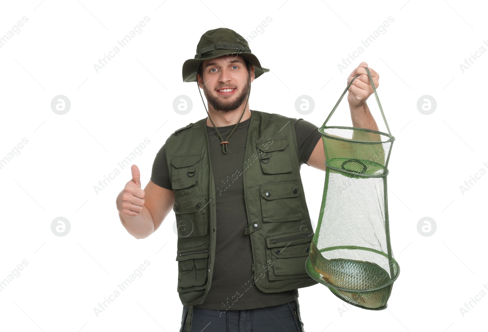 Photo of Fisherman holding fishing net with catch and showing thumb up isolated on white