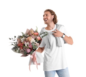 Young handsome man with beautiful flower bouquet on white background