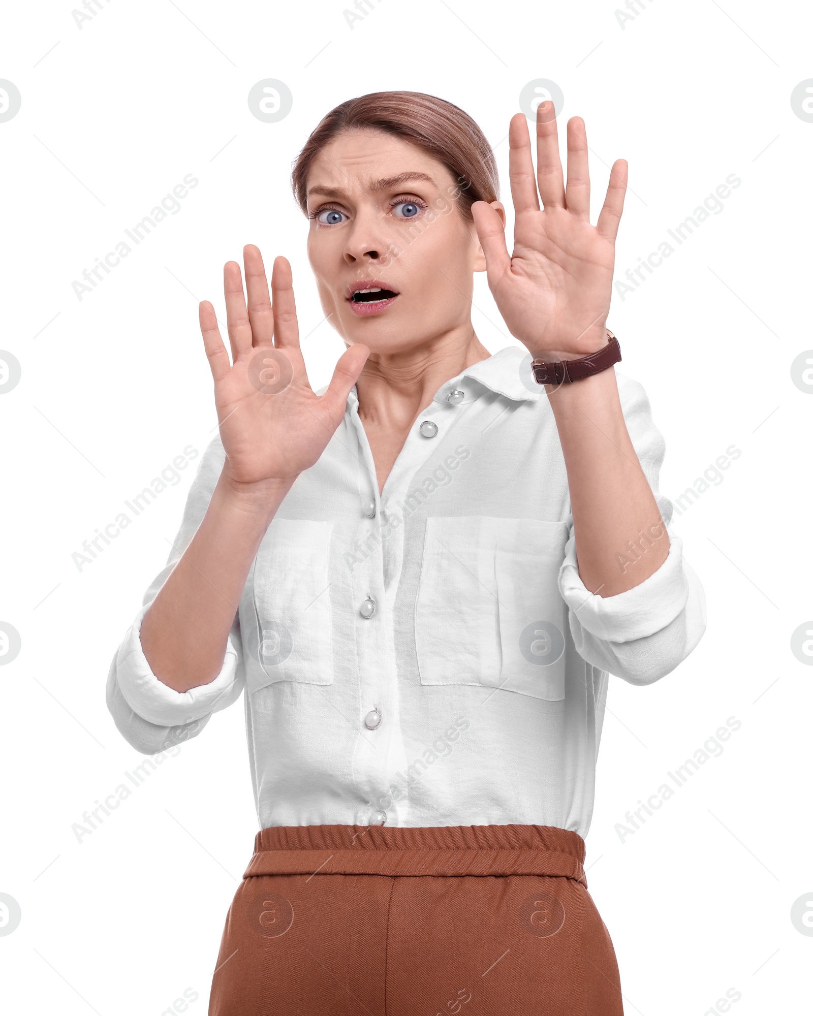 Photo of Beautiful emotional businesswoman avoiding something on white background