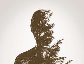 Image of Double exposure with silhouette of woman and trees, sepia effect