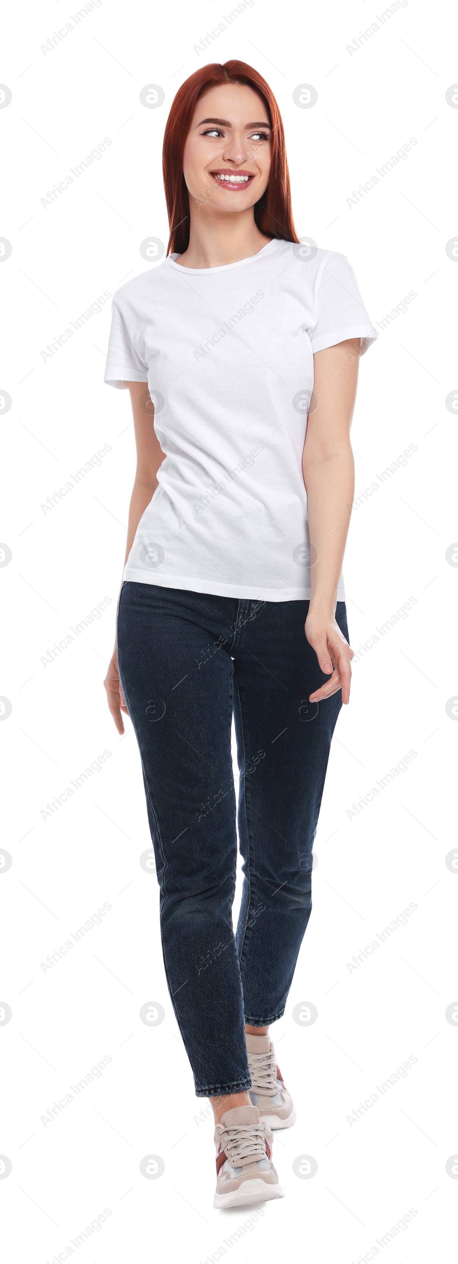 Photo of Happy woman with red dyed hair walking on white background