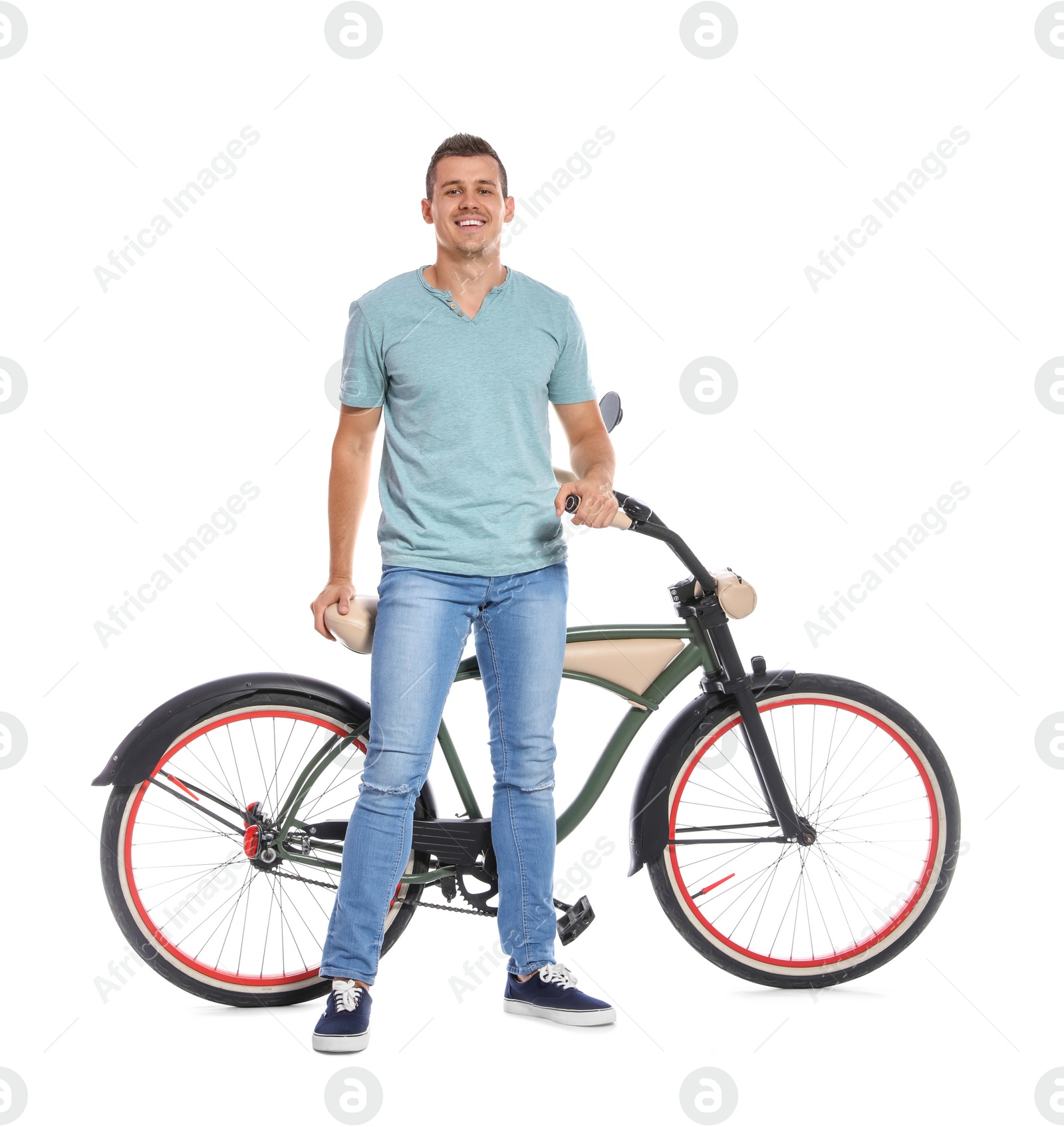 Photo of Portrait of handsome man with bicycle on white background