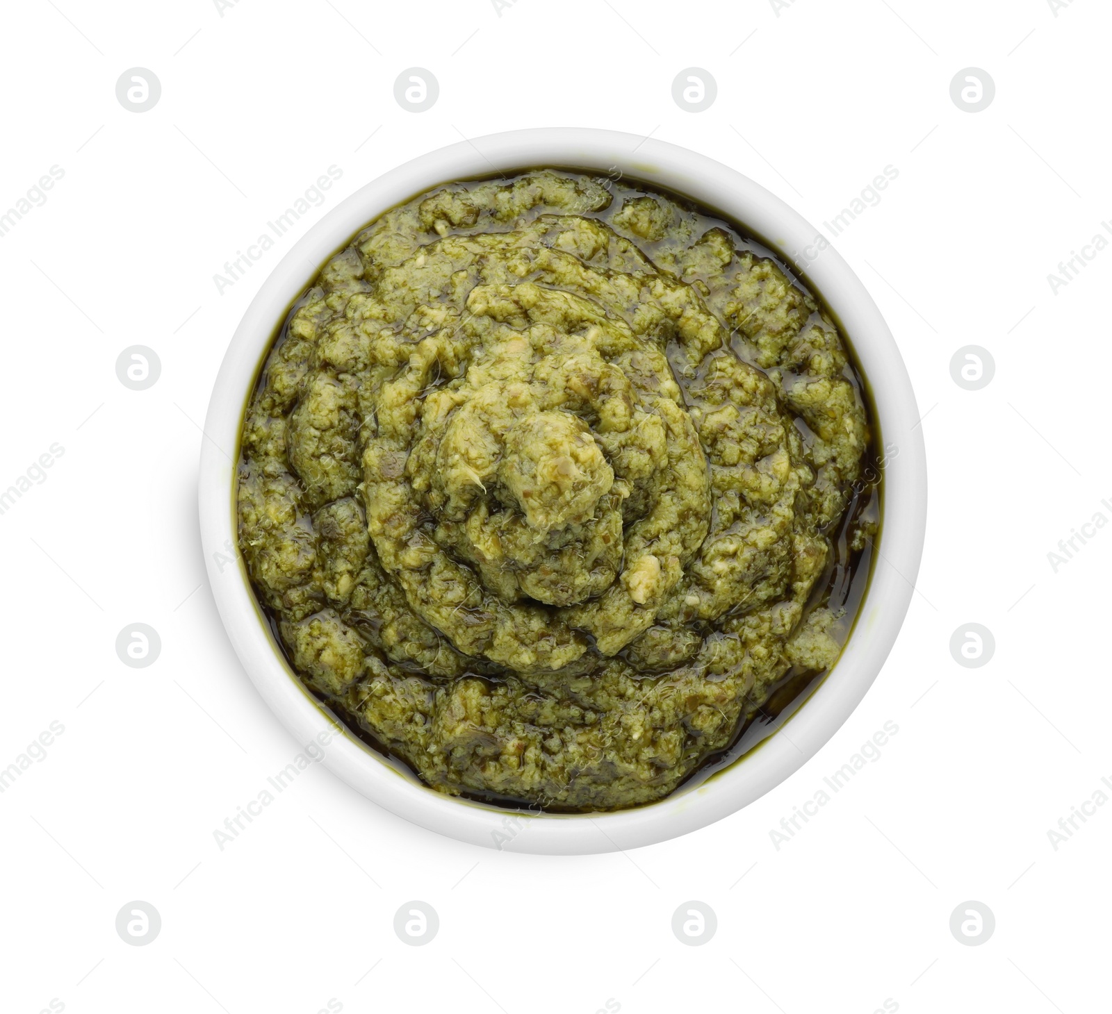 Photo of Tasty pesto sauce in bowl isolated on white, top view