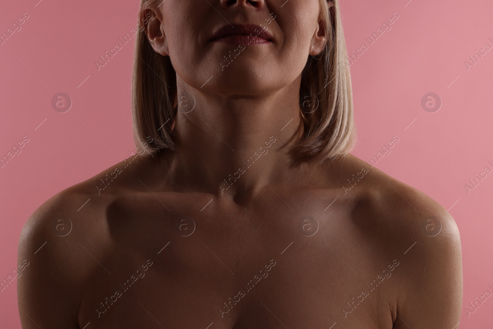 Photo of Woman with healthy skin on pink background, closeup