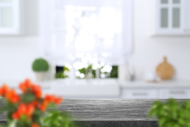 Image of Textured table in light kitchen. Space for design