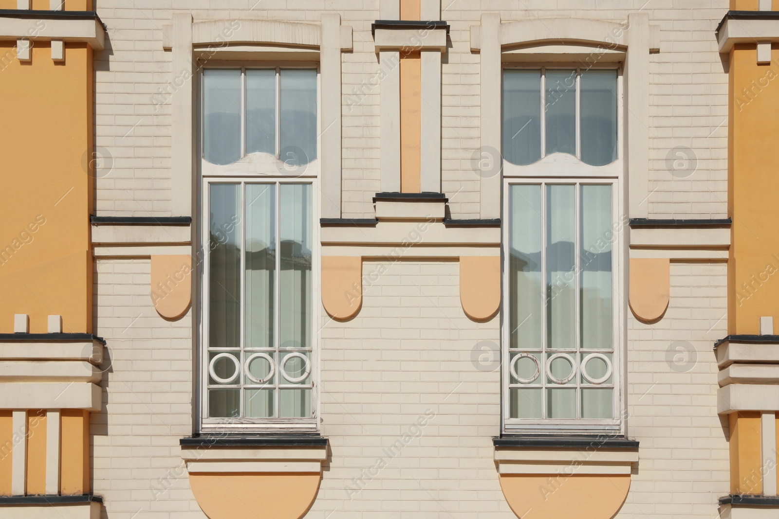 Photo of Wall of vintage building with beautiful windows