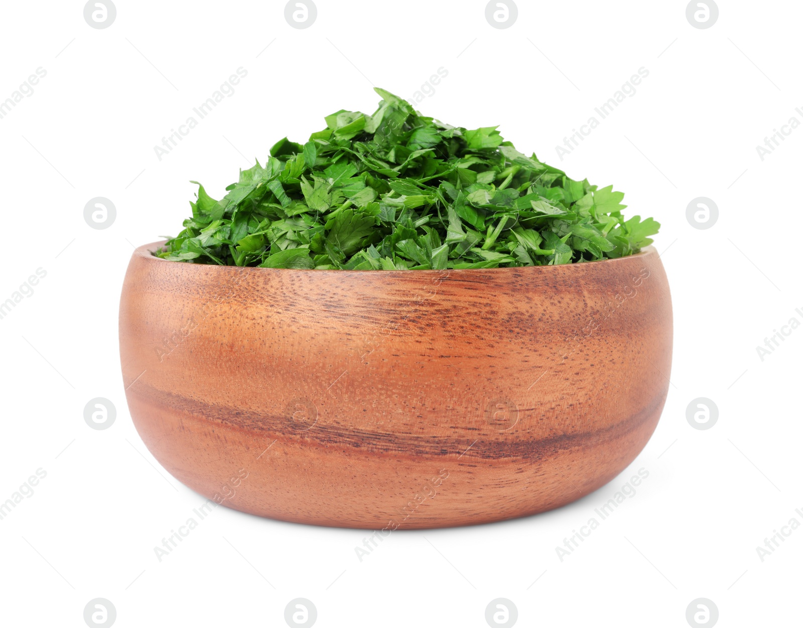 Chopped parsley leaves in wooden bowl isolated on white Photo of Chopped parsley leaves in wooden bowl isolated on white
