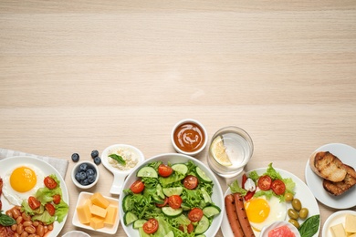 Different delicious dishes on buffet table, flat lay. Space for text