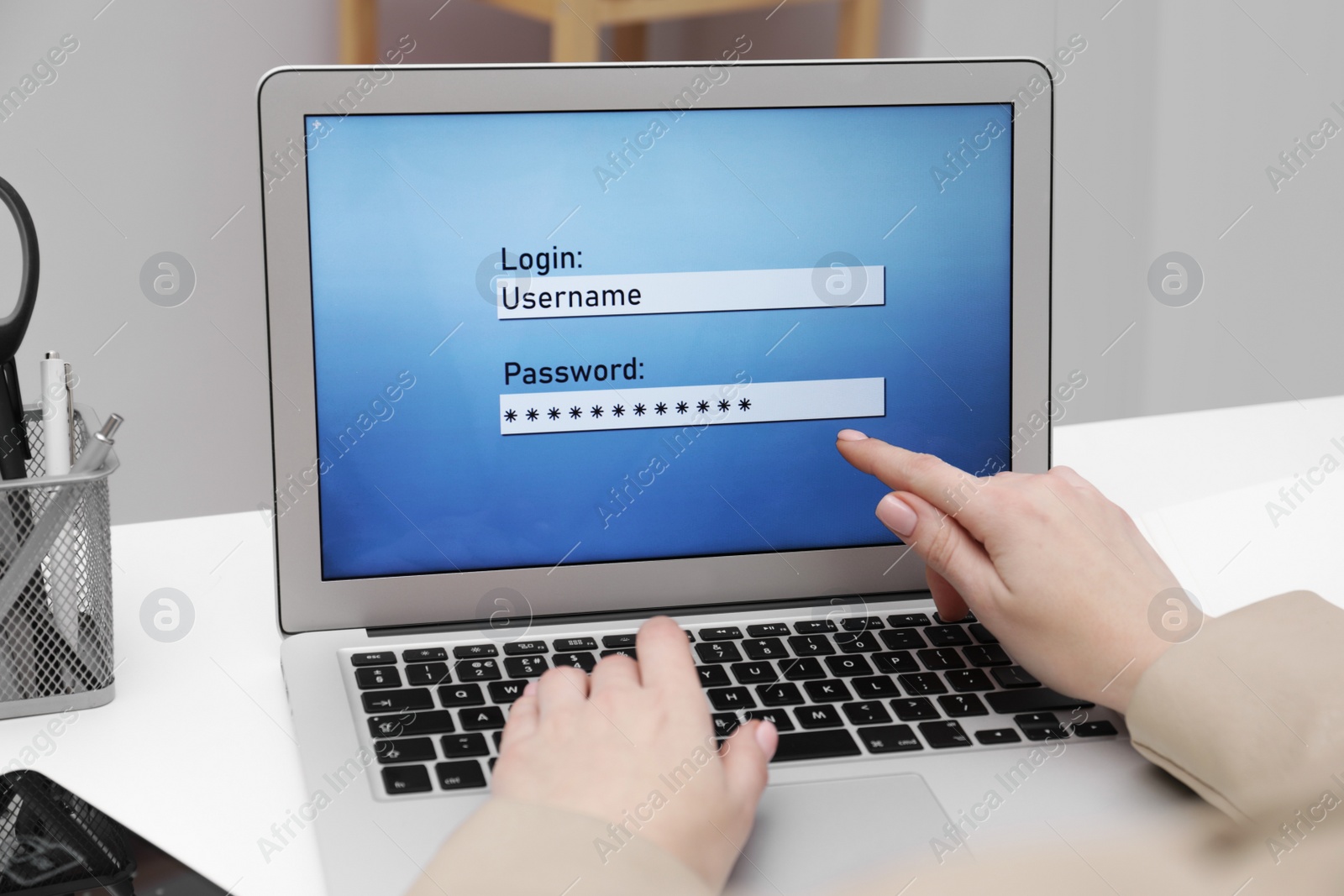 Photo of Woman unlocking laptop with blocked screen indoors, closeup