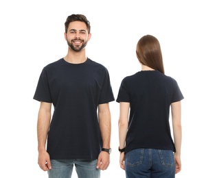 Photo of Young people in t-shirts on white background. Mock up for design