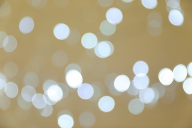 Photo of Blurred view of shiny silver lights. Bokeh effect