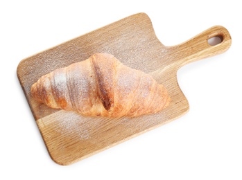 Photo of Wooden board with tasty croissant and powdered sugar on white background, top view. French pastry