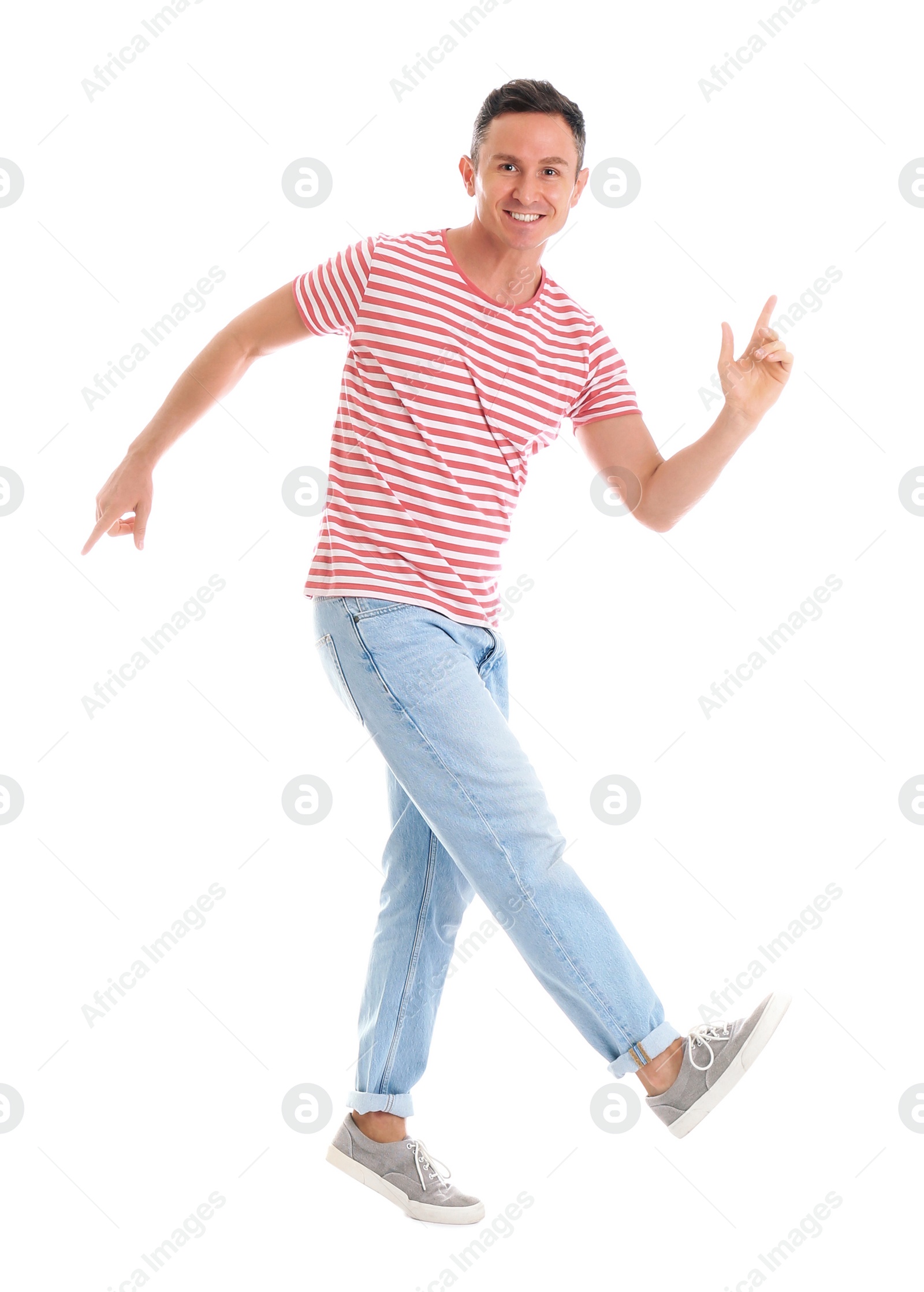 Photo of Happy attractive man dancing on white background