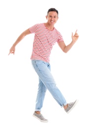 Happy attractive man dancing on white background