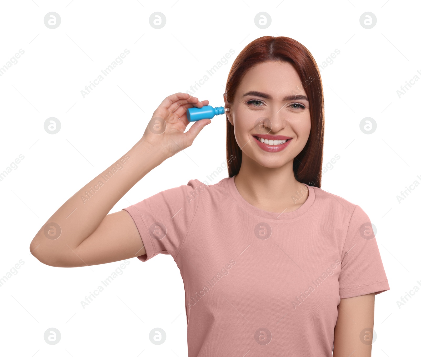 Photo of Woman using ear drops on white background