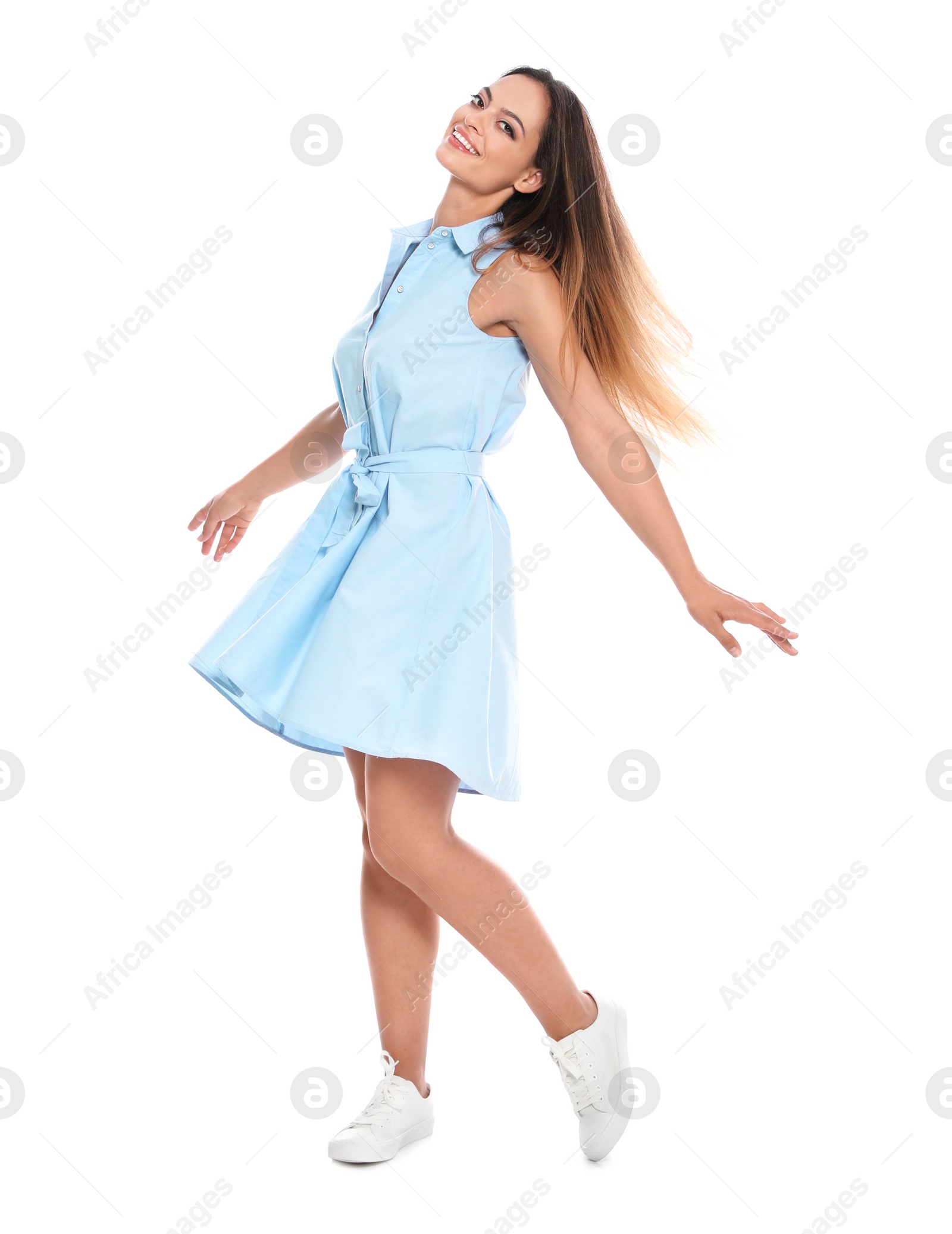 Photo of Full length portrait of happy young woman in dress on white background