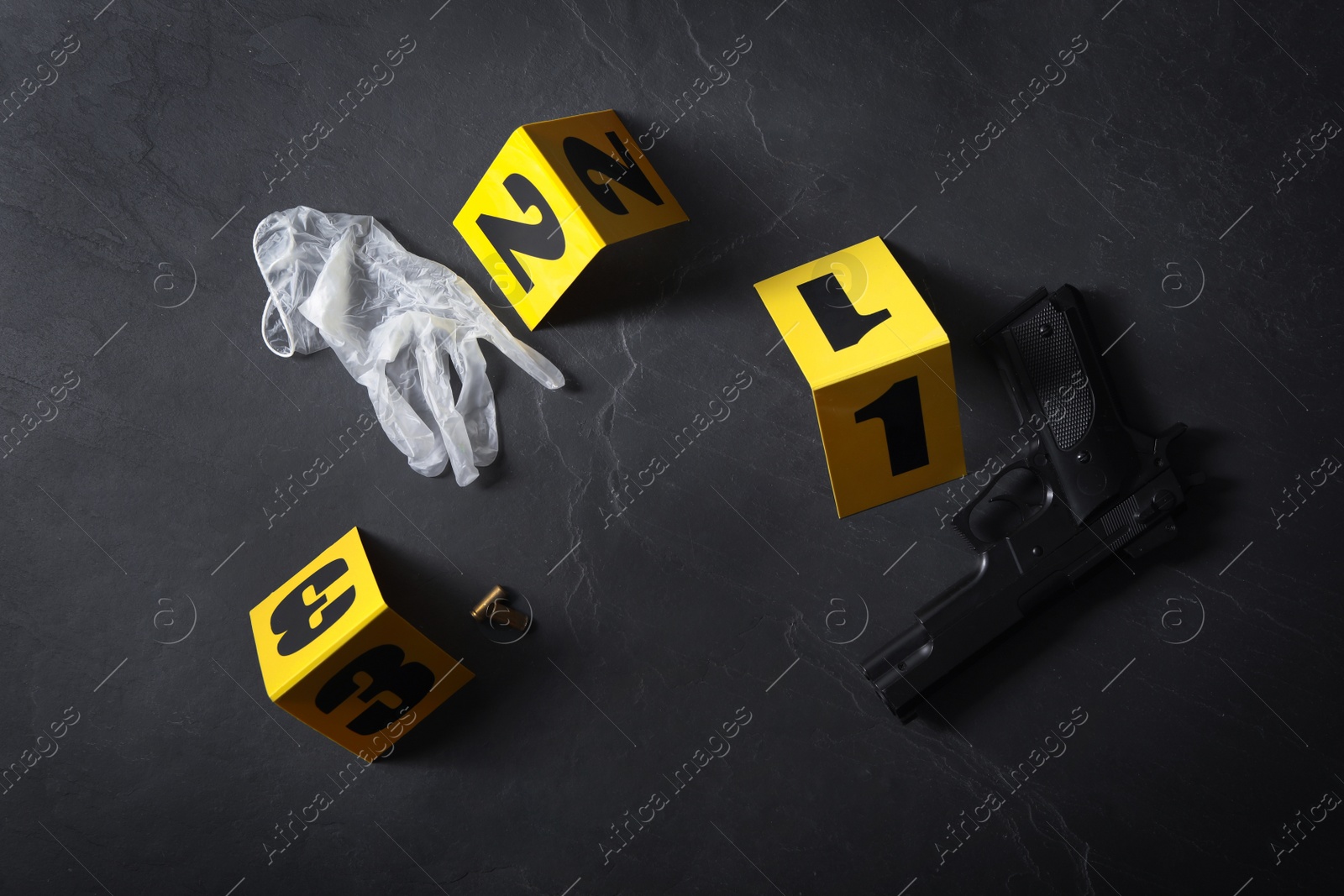 Photo of Flat lay composition with evidences and crime scene markers on black background