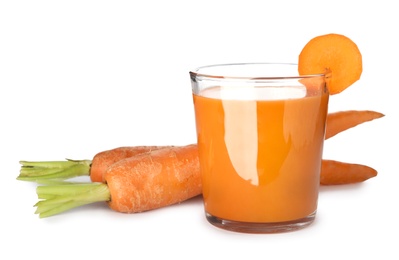 Carrot and glass of fresh juice on white background