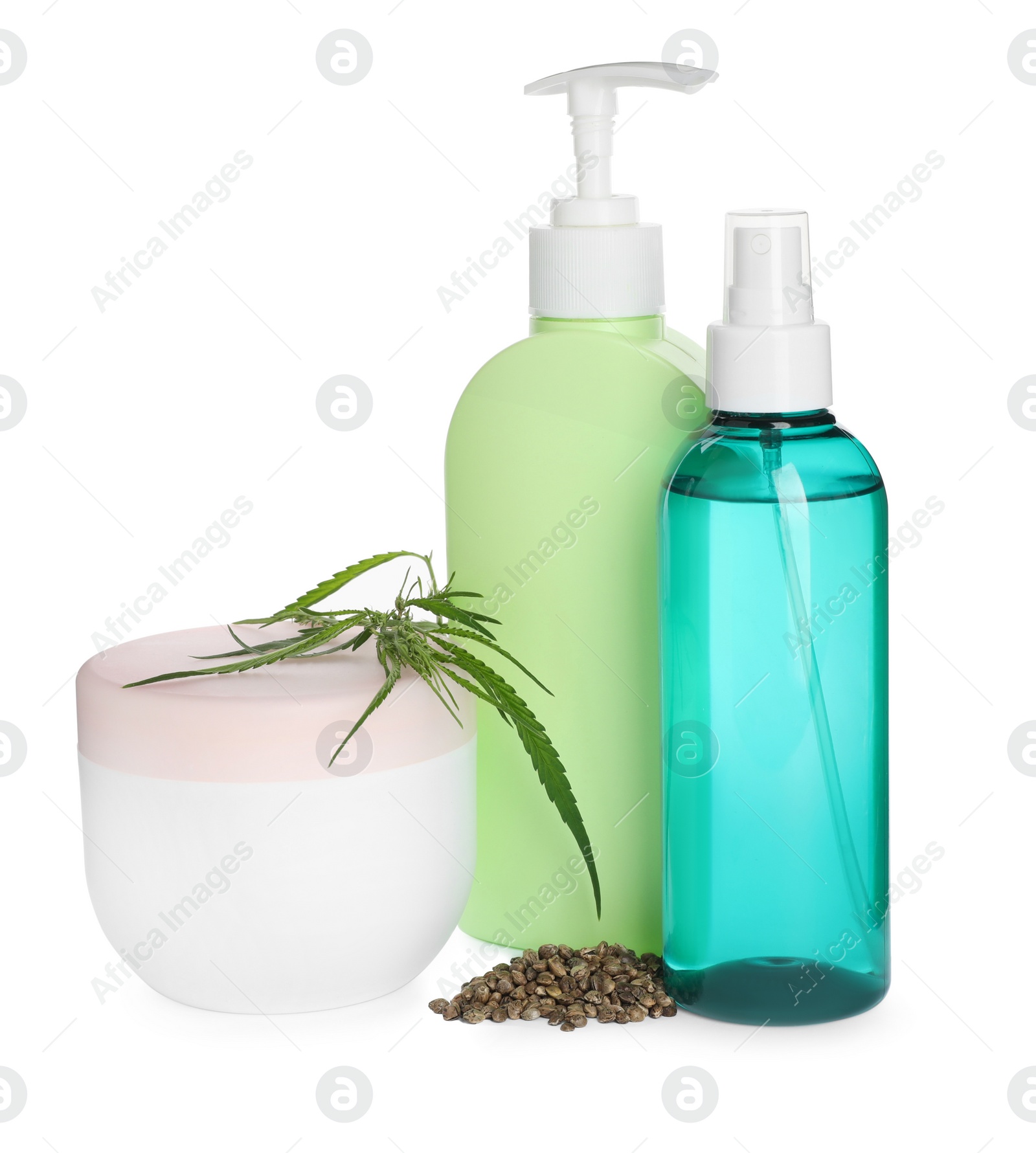 Photo of Set of hemp cosmetics with green leaves and seeds isolated on white