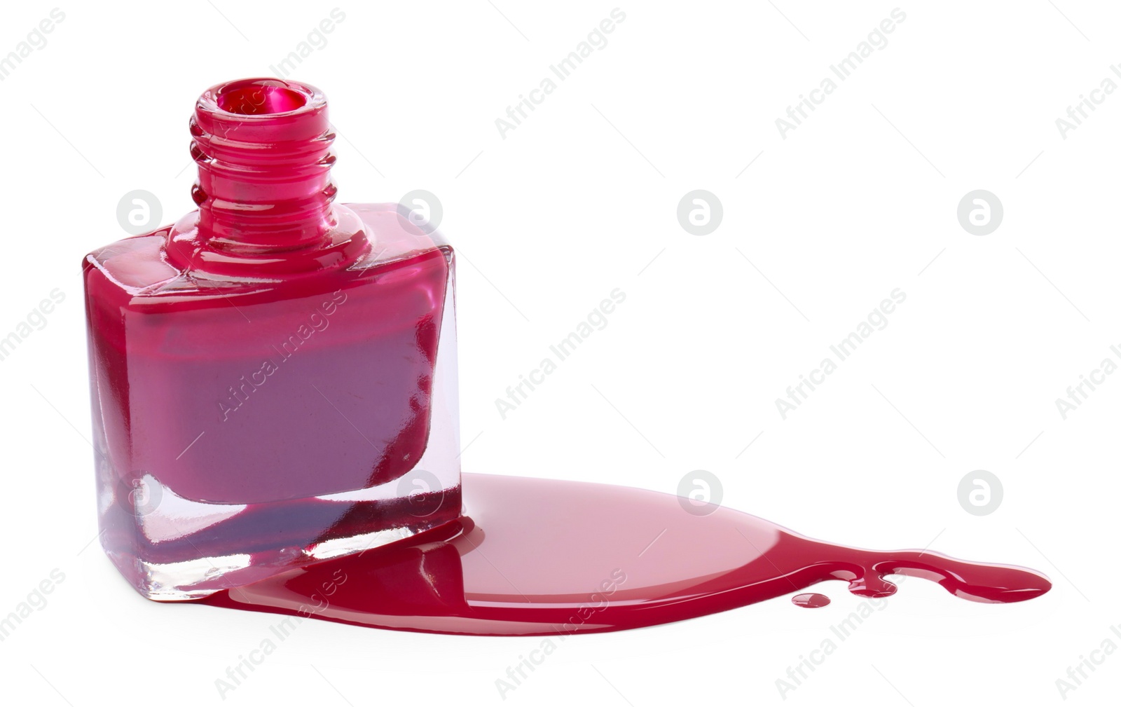 Photo of Bottle and spilled pink nail polish isolated on white